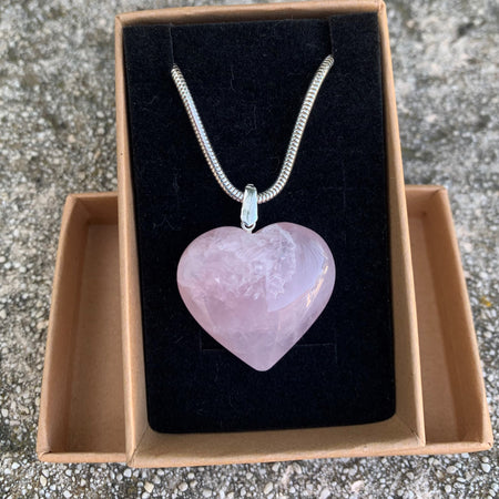 Natural rose quartz pendant with its silver chain